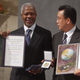 United Nations Secretary General Kofi Annan (L) and Korean Foreign Minister and President of the General Assembly Han Seung Soo show their medals and certificate during the 2001 Nobel Peace Prize in Oslo December 10, 2001. Annan received the centenary Nobel Peace Prize alongside the United Nations.